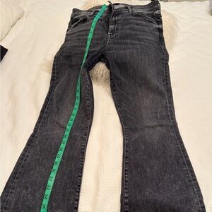 Mother black jeans with a flare bottom .